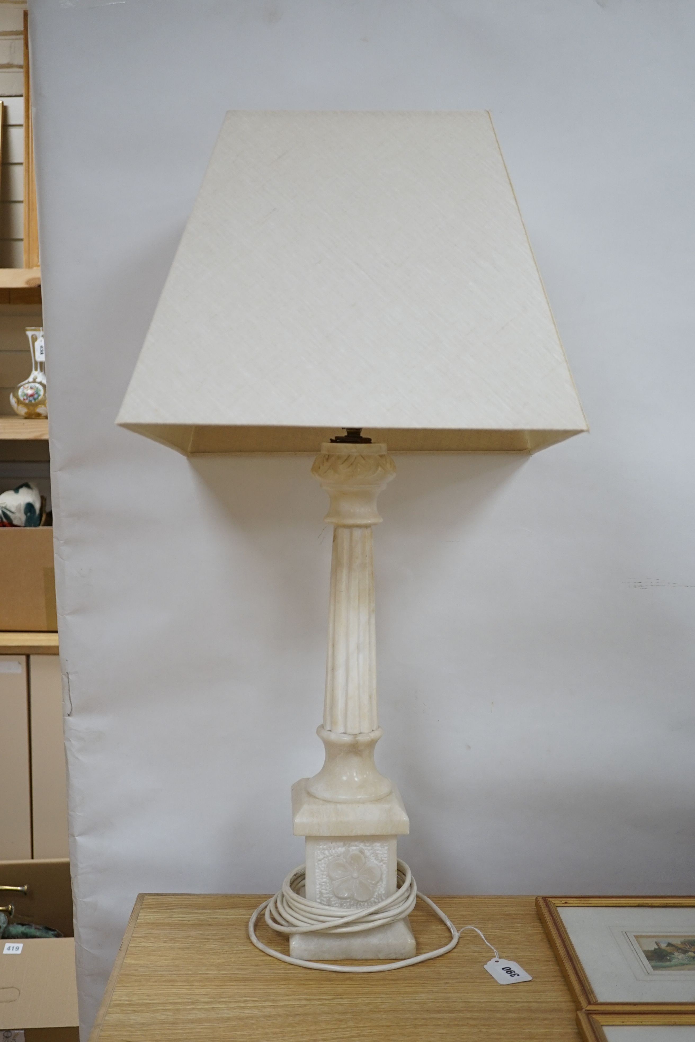 An alabaster desk lamp with shade